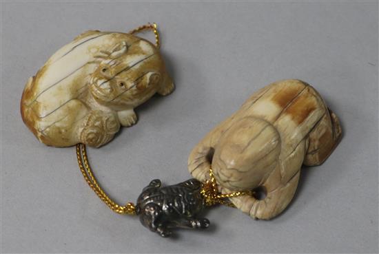 Two ivory figures of a cat and a crouching man